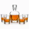 Rounded whiskey decanter set with four old fashioned whiskey glasses