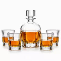 Rounded whiskey decanter set with four old fashioned whiskey glasses