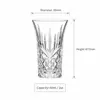 2oz whiskey shot glass with decorative geometric detailing and flared rim