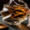 Sculptural glass whiskey decanter featuring an irregular textured surface and stopper