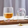 Double wall heart glass with transparent body and creative blue heart decoration