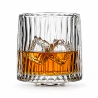 Mountain base whiskey glass with sculpted interior landscape and ribbed texture