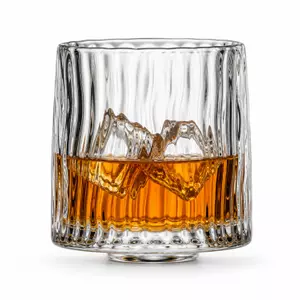 Mountain base whiskey glass with sculpted interior landscape and ribbed texture