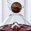 decorative wine decanter featuring distinctive wooden ball stopper and clear glass body