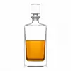 Tall rectangular whiskey decanter with clear glass body and square stopper