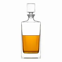 Tall rectangular whiskey decanter with clear glass body and square stopper