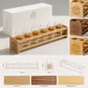 Twelve-piece whiskey shot glass set with wooden holder for wholesale hospitality and retail buyers