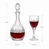 Decorative patterned red wine decanter featuring an elegant glass stopper