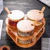 Premium glass spice jar set with natural bamboo lids and matching wooden spoons