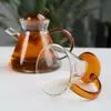 Transparent glass teapot with amber accents for brewing green tea, black tea, and loose leaf tea