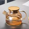 Elegant glass beverage jug with metal lid for water, juice, lemonade, and iced tea