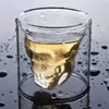 Jiateng double-wall insulated whiskey glass featuring a creative skull shape, filled with golden amber liquor.