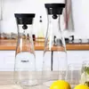 Elegant transparent glass water carafe with lid for juice and cold beverages