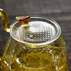 Stylish hammered glass kettle and tea cups for modern tea ceremonies