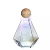 Minimalist glass water carafe with colorful reflective surface and wooden lid