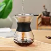 Stylish glass coffee server with black silicone collar for modern coffee brewing setups