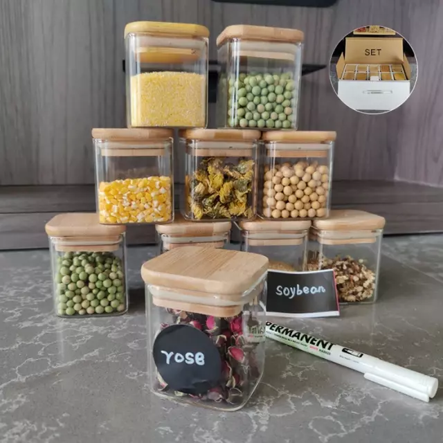 Borosilicate glass jars with natural bamboo lids and chalkboard labels, storing pasta and cereal.