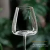 Jiateng high-transparency crystal wine glasses displayed on a clean table with greenery backdrop, perfect for home entertaining or fine dining.