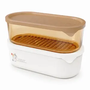 1090ml oval stackable food storage container with beige lid transparent amber upper section removable drain tray and white base
