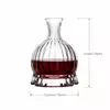 Decorative pedestal base wine decanter with vertical ribbed glass body