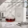 Decorative glass wine decanter measuring 190mm high and 154mm wide