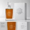 Tall clear spirits serving decanter with straight body and geometric stopper