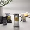 Contemporary ribbed glass serving pitcher for restaurants, cafés, hotels, and modern kitchens SEO Product Description