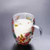 A set of two Jiateng transparent glass mugs featuring colorful pressed flowers suspended between layers for a unique look.