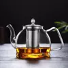 Contemporary glass tea kettle with filter for blooming tea and loose leaf tea brewing