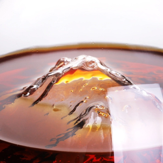 Close-up detail of Jiateng wine decanter's iceberg mountain base, showcasing intricate 3D texture and premium glass craftsmanship
