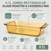 Top view of a large amber glass baking dish featuring a rectangular opening, rounded corners and two integrated side handles.