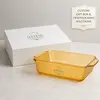 Top view of a 4.1L amber rectangular glass baking dish with rounded corners, wide cooking area and two integrated side handles.