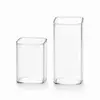 Modern clear square drinking glass with rounded corners and smooth transparent body