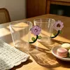 Floral glass mug with colorful flower shaped handle for everyday drinks
