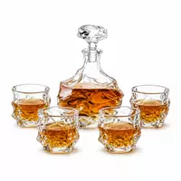 Textured whiskey decanter set with four matching rock glasses