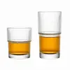 Ribbed stackable drinking glass set with short tumbler and tall highball glass