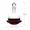 Clear glass red wine decanter with decorative round stopper and wide base