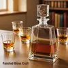 Clear square whiskey decanter featuring a distinctive decorative glass stopper