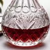 Red wine decanter serving set with four coordinated stemmed wine glasses