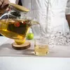 Modern glass teapot with wooden lid suitable for home kitchens, cafés, hotels, and tea houses