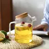 Premium borosilicate glass drink carafe with wooden lid and drip-free pouring spout