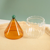 Jiateng glass cup featuring ribbed body and gnome hat lid, perfect for serving hot or cold drinks, elegant and creative design