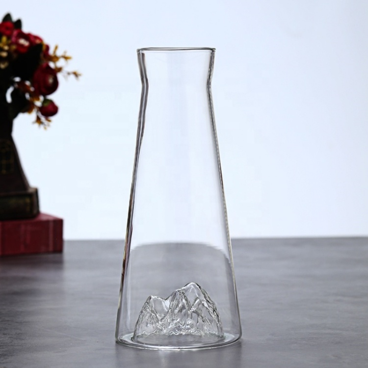 Handmade glass pitcher and tumbler featuring a 3D mountain design at the bottom, ideal for modern kitchen and dining décor