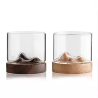 Creative mountain whiskey glass tumbler with elegant wooden base for bourbon and cocktails