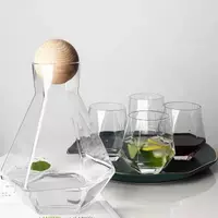 Modern iridescent glass water pitcher with wooden lid for stylish beverage serving