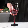 Close-up detail of Jiateng red stem wine glass, highlighting the vibrant color and premium lead-free crystal craftsmanship.