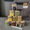 Clear glass food storage jars with writable chalkboard stickers for easy kitchen inventory.