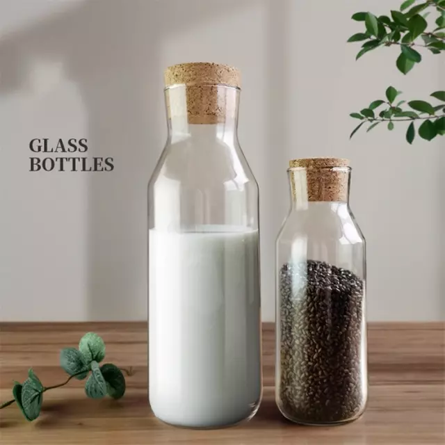 Transparent glass bottles with natural cork stoppers, airtight and leakproof design, perfect for storing milk, juice, dry fruits, or grains in the kitchen