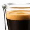 Clear double wall coffee glass with a gently curved outer wall and rounded inner beverage chamber