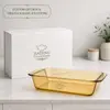 Side view of a 7cm deep amber borosilicate glass baking dish designed for casseroles, baked pasta and roasted vegetables.